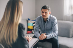Man meeting with psychotherapist