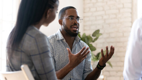 Man talking in group session about matrix model