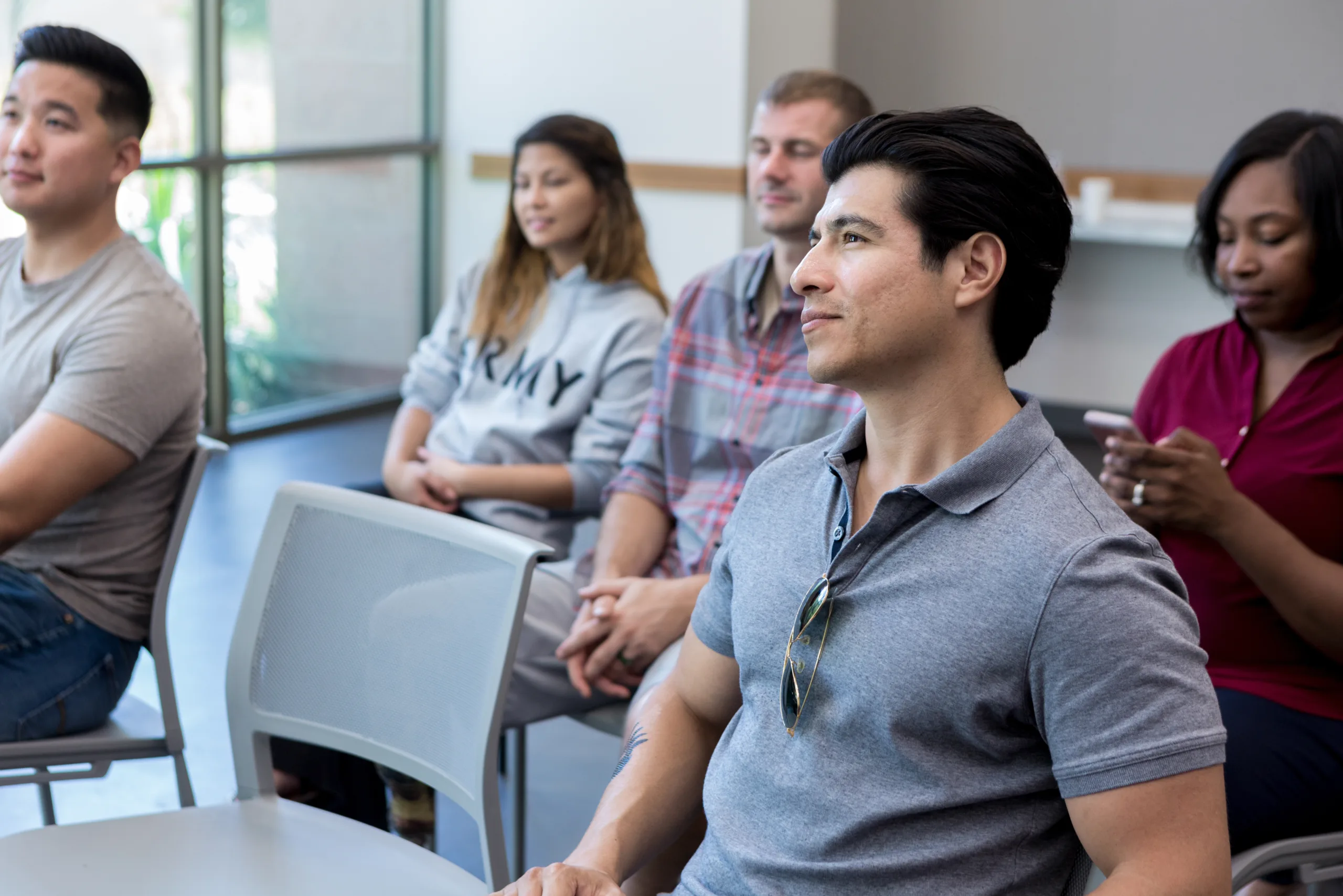 an-audience-of-military-veterans-attend-a-seminar-for-veterans-they-are-listening-attentively-to-the-speaker-stockpack-gettyimages An audience of military veterans attend a seminar for veterans. They are listening attentively to the speaker.