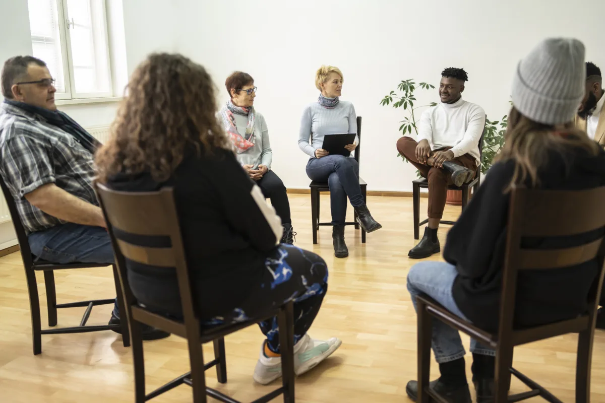 group-therapy-support-meeting-talking-about-their-mental-health-in-a-modern-mental-health-facility-stockpack-gettyimages-1200x800