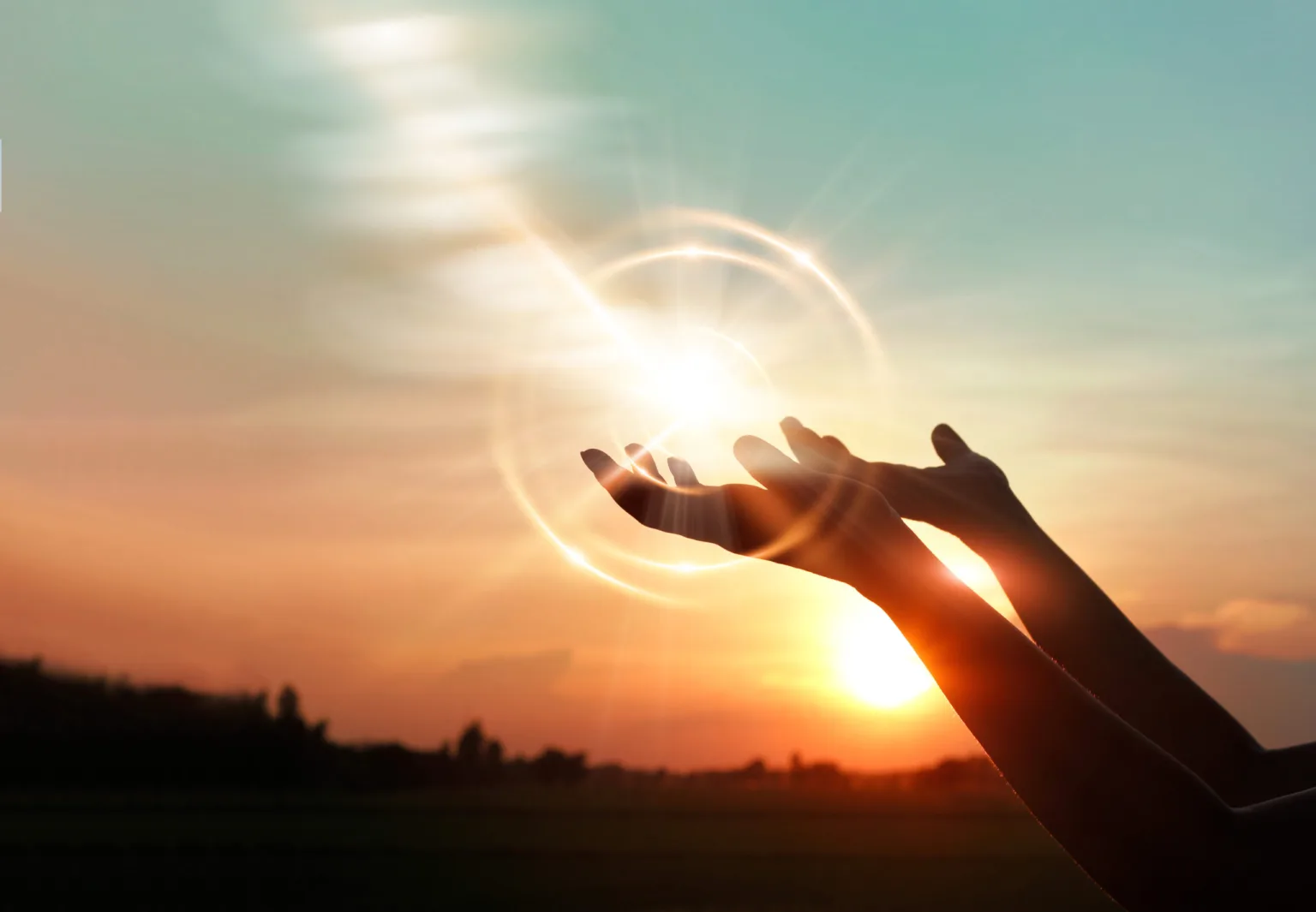 woman-hands-praying-for-blessing-from-god-on-sunset-background