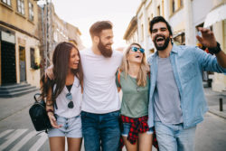 Group of friends hanging out, having fun and enjoying summer days