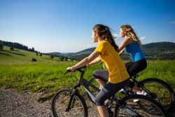 Healthy lifestyle - young women biking