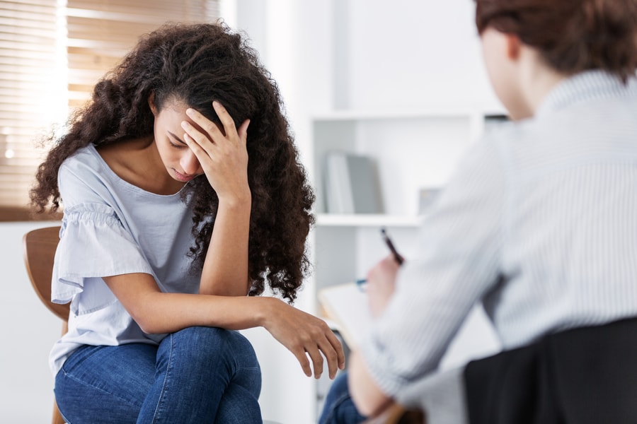 Woman at Psychotherapist for Symptoms of PTSD