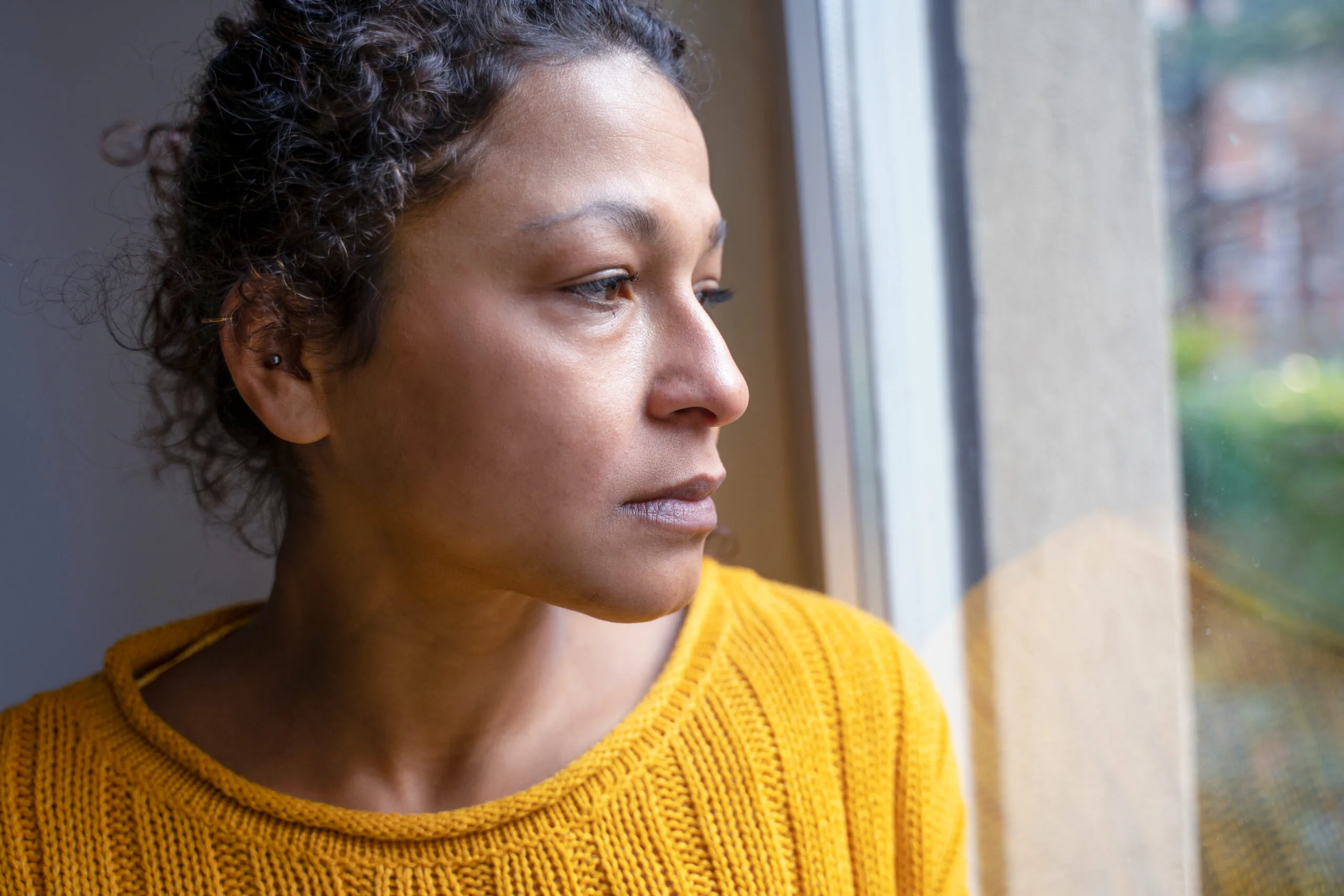 Black woman feeling negative emotions alone at home