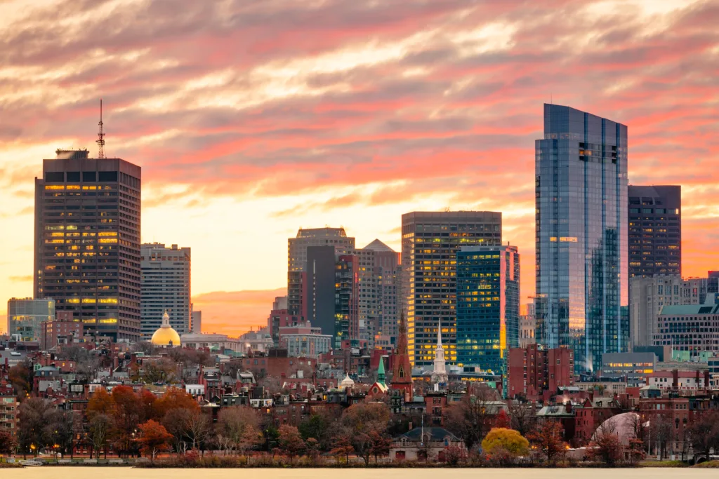 Boston, Massachusetts, USA downtown cityscape from across the Charles River at dawn.