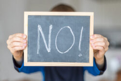 boy-holds-blackboard-with-no-letters-stockpack-gettyimages