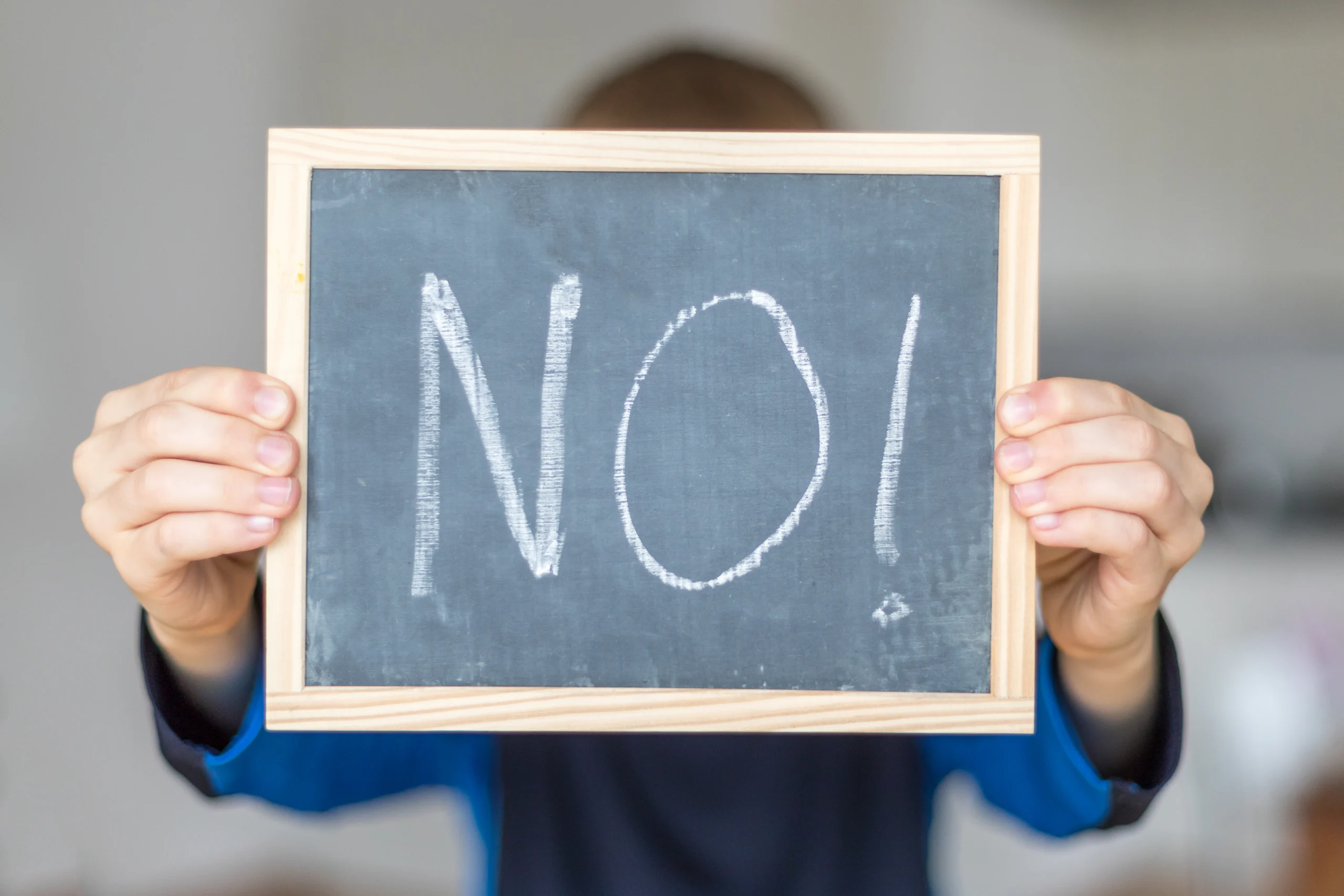 boy-holds-blackboard-with-no-letters-stockpack-gettyimages