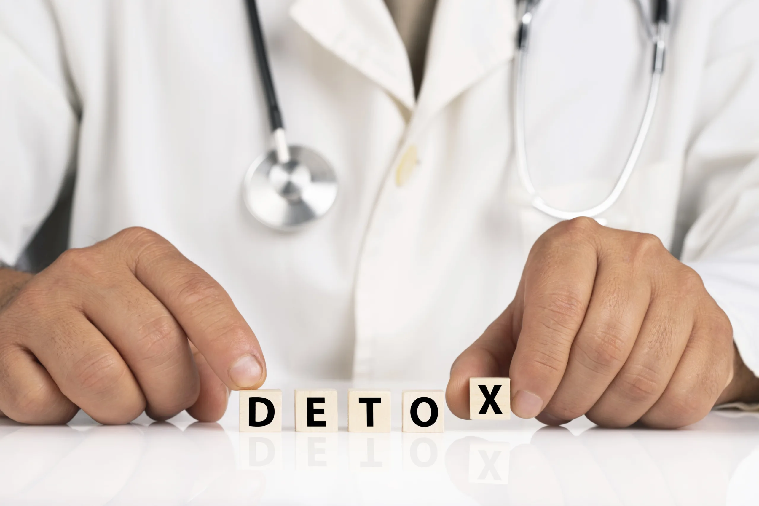 Doctor and cubes with text DETOX