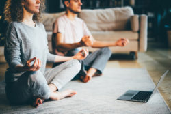 couple in pajamas preparing for meditation