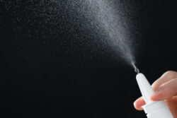 mans-hand-with-a-bottle-of-medication-treatment-colds-via-a-nasal-spray-stockpack-gettyimages